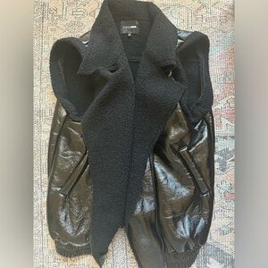Black fake leather vest. Size small. Only worn once.